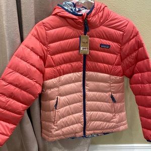 New with tags. Girls Patagonia coat. Size XL or 14. Reversible.